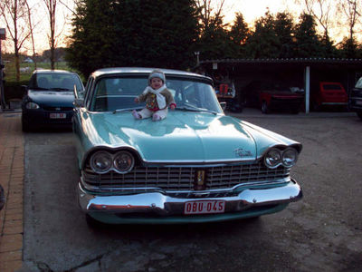 Elana loves sitting on the hood 
