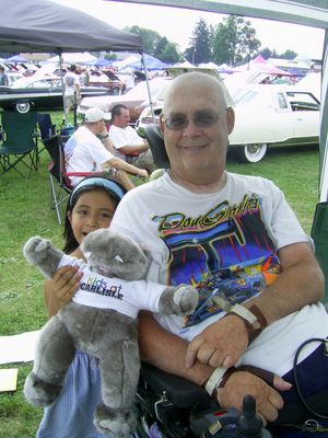 Curt with his lovely daughter Grace at Carlisle 2010
Curt’s health has made it difficult to get around much, but in 2008 he, Jo Ann and daughter Grace made it to the Carlisle All-Chrysler Nationals, where many like-minded ’59 Plymouth enthusiasts dropped their jaws to see such a stunning customization. They had to skip the show in 2009 but came back in 2010 and we hope to see them every year from now on. 
